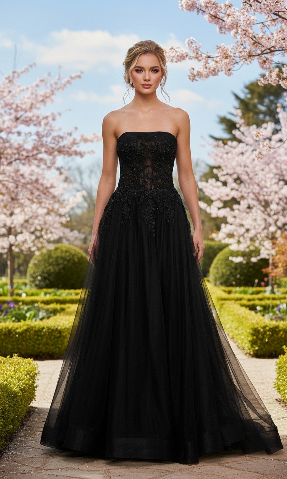 A woman in the La Femme 33528 long prom dress, featuring a strapless ball gown silhouette and sheer corset bodice, stands on a garden path with blooming pink trees and manicured hedges.